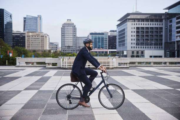 man riding her bike helmet