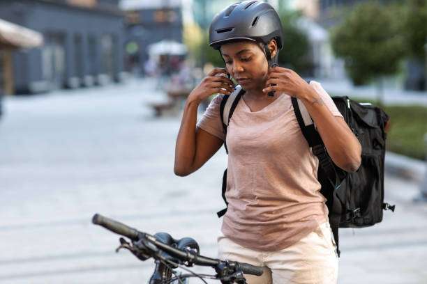 Riding a bike while wearing a bike helmet