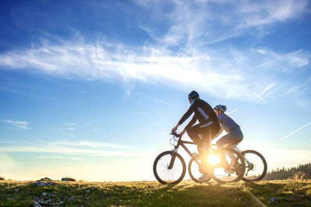 Happy mountain bike couple outdoors bike helmet