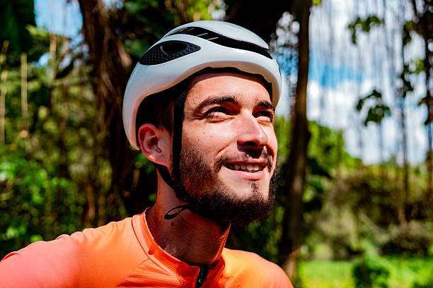 A man wearing a bike helmet