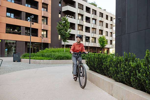 A female cyclist wearing a bike helmet 