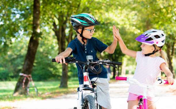bike helmet on and fastening it.