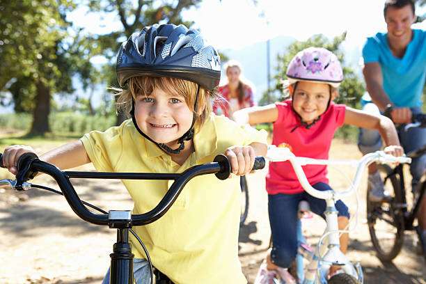 putting on a protective bike helmet